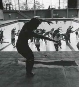 People exercising in an empty Sparks Pool.