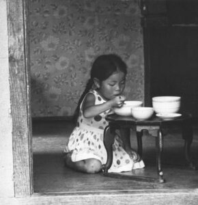 child eating alone